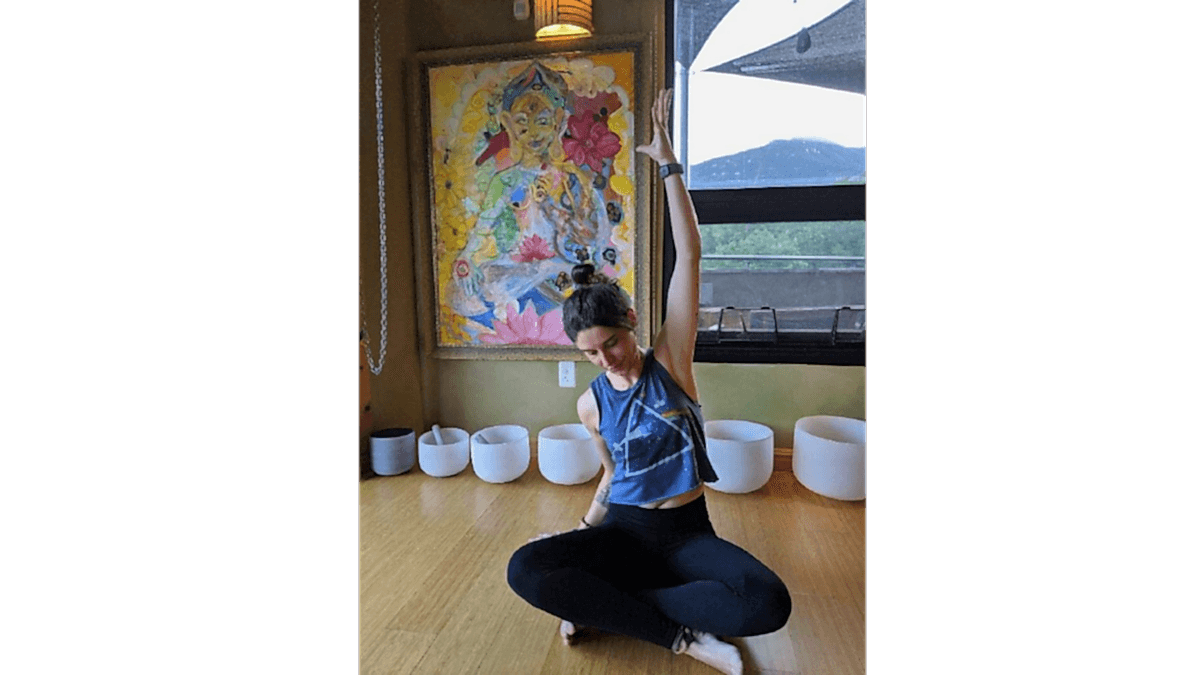 Shelby in a seated side-stretch