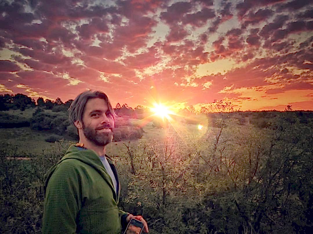 Austin in fornt of a sunrise