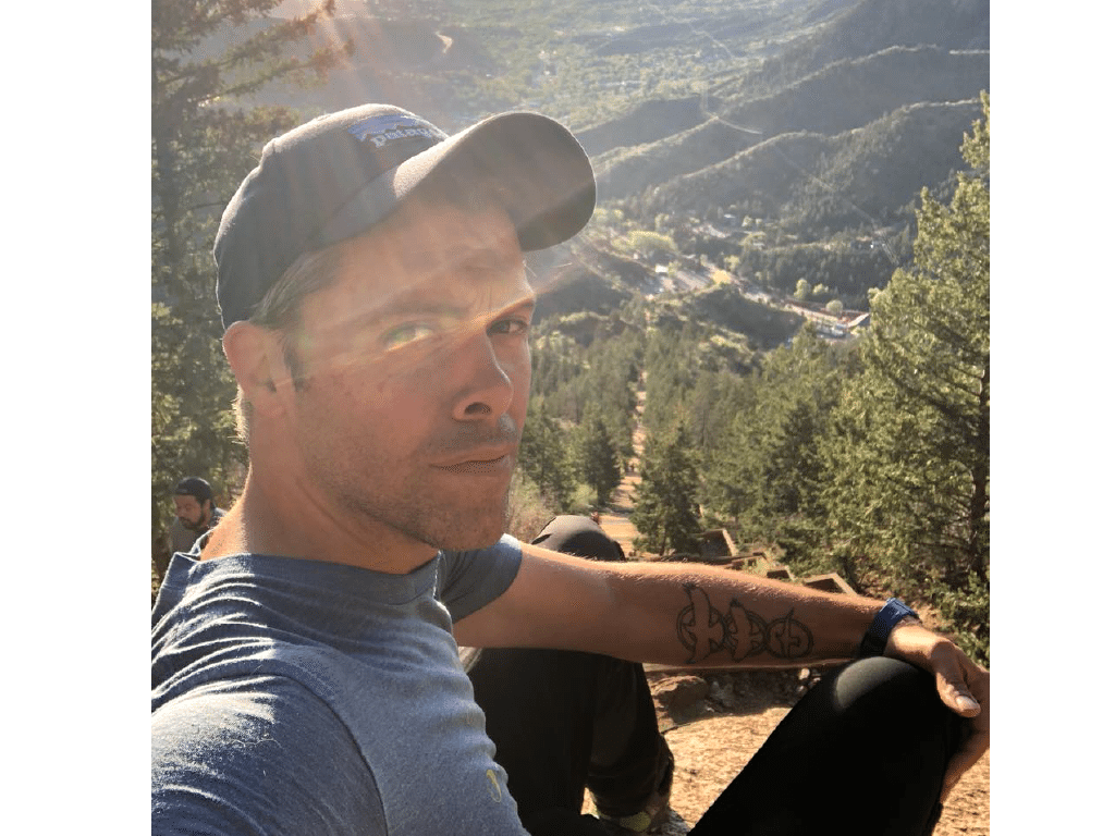 Photo of Austin at the top of the Inlcine