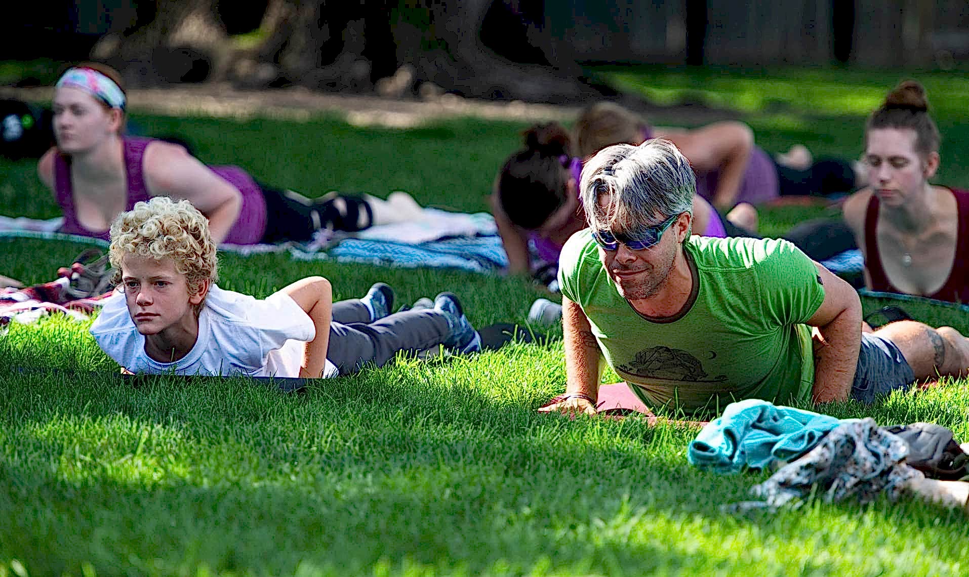Photo of Austin in baby cobra pose in the park
