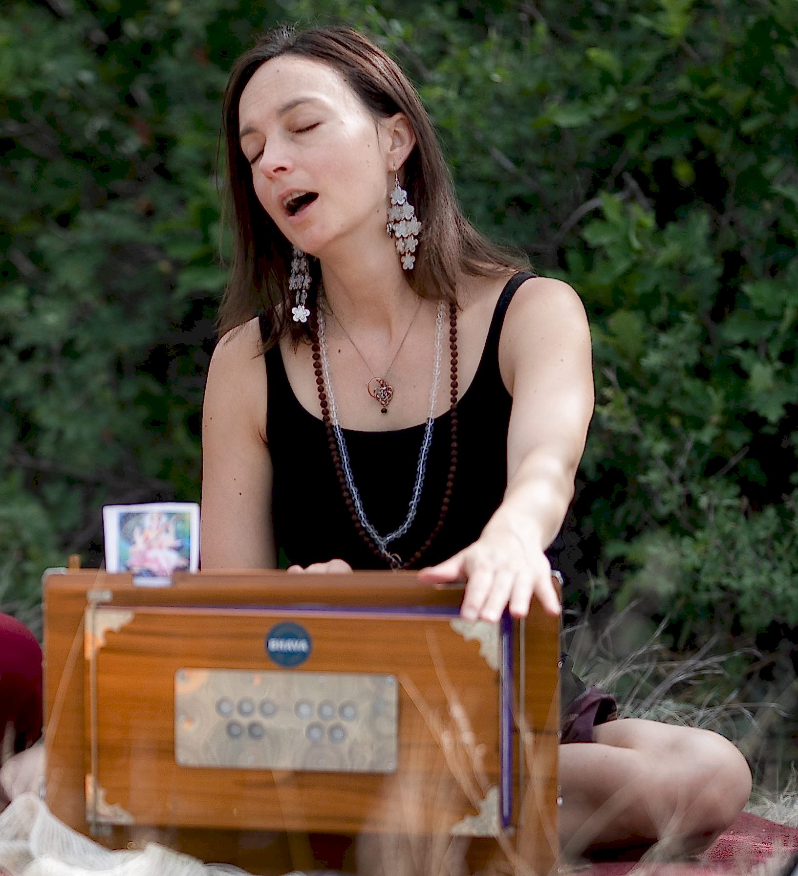 Suzanna playing a harmonium